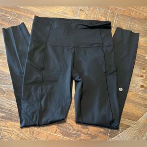 Lululemon leggings! Size 6. Black. With side pockets and reflective details.